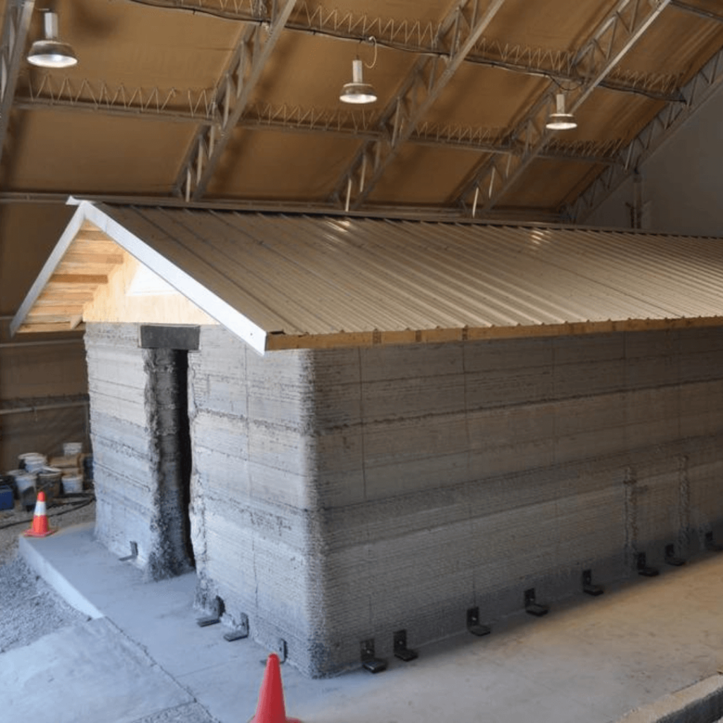 Completed 3-D printed concrete barracks structure